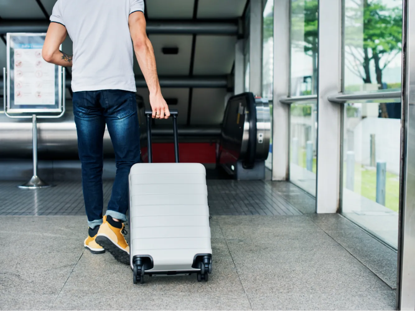 white-man-carrying-luggage