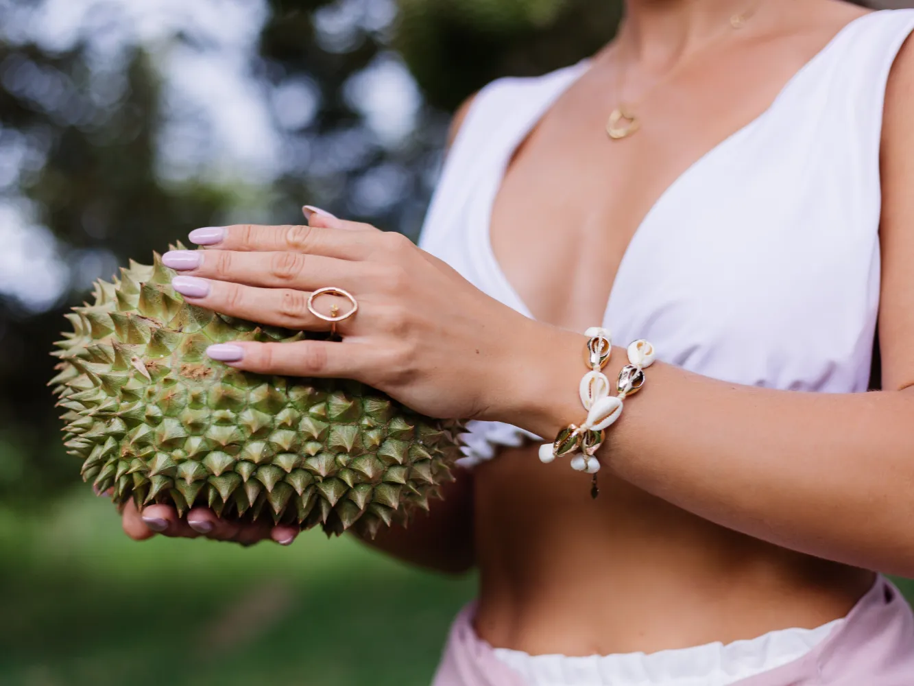 young-stylish-woman-holding-durian-fruit