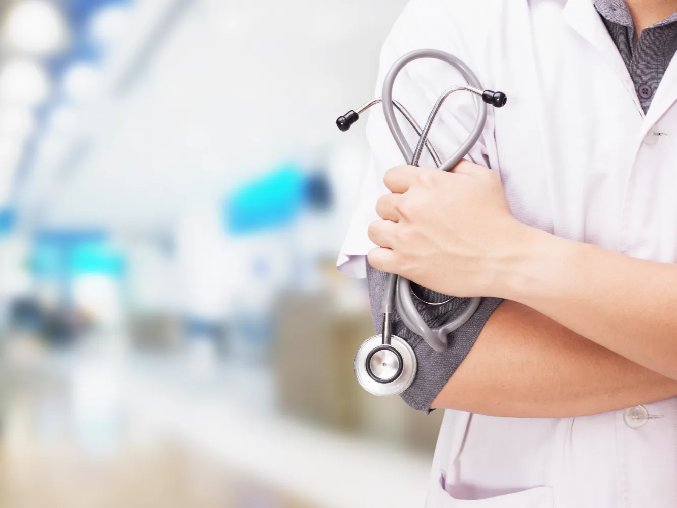 doctor-with-stethoscope-hands-hospital-background