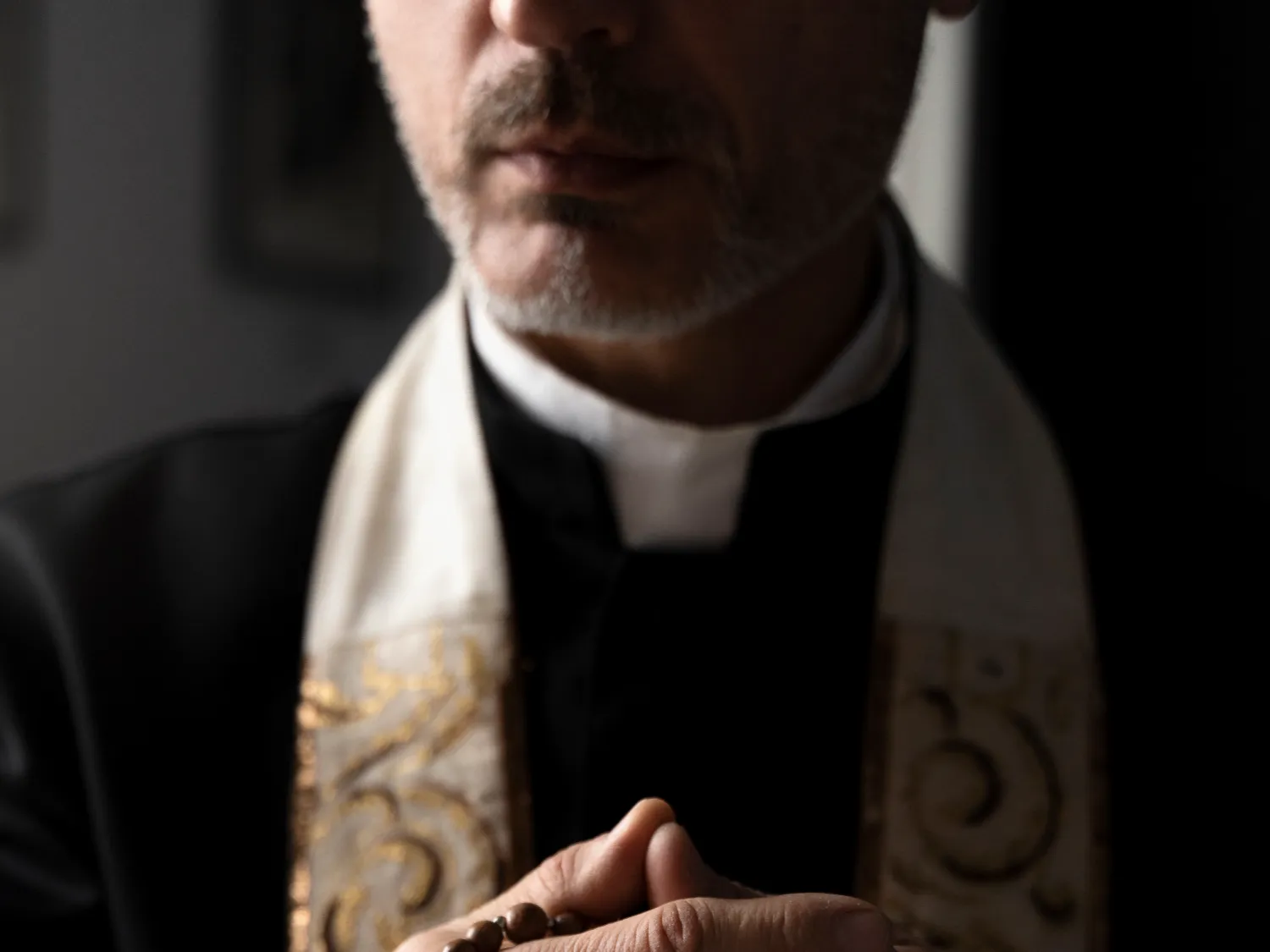 close-up-priest-holding-crucifix