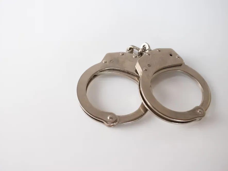 high-angle-shot-metal-handcuffs-isolated_181624-28402
