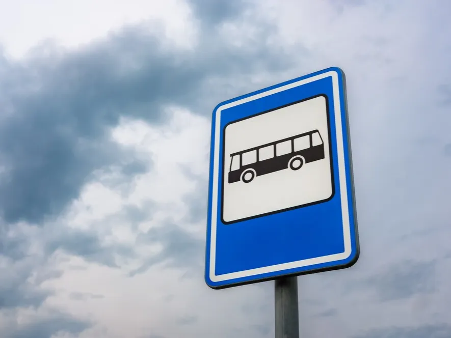 low-angle-shot-bus-stop-sign_181624-32465