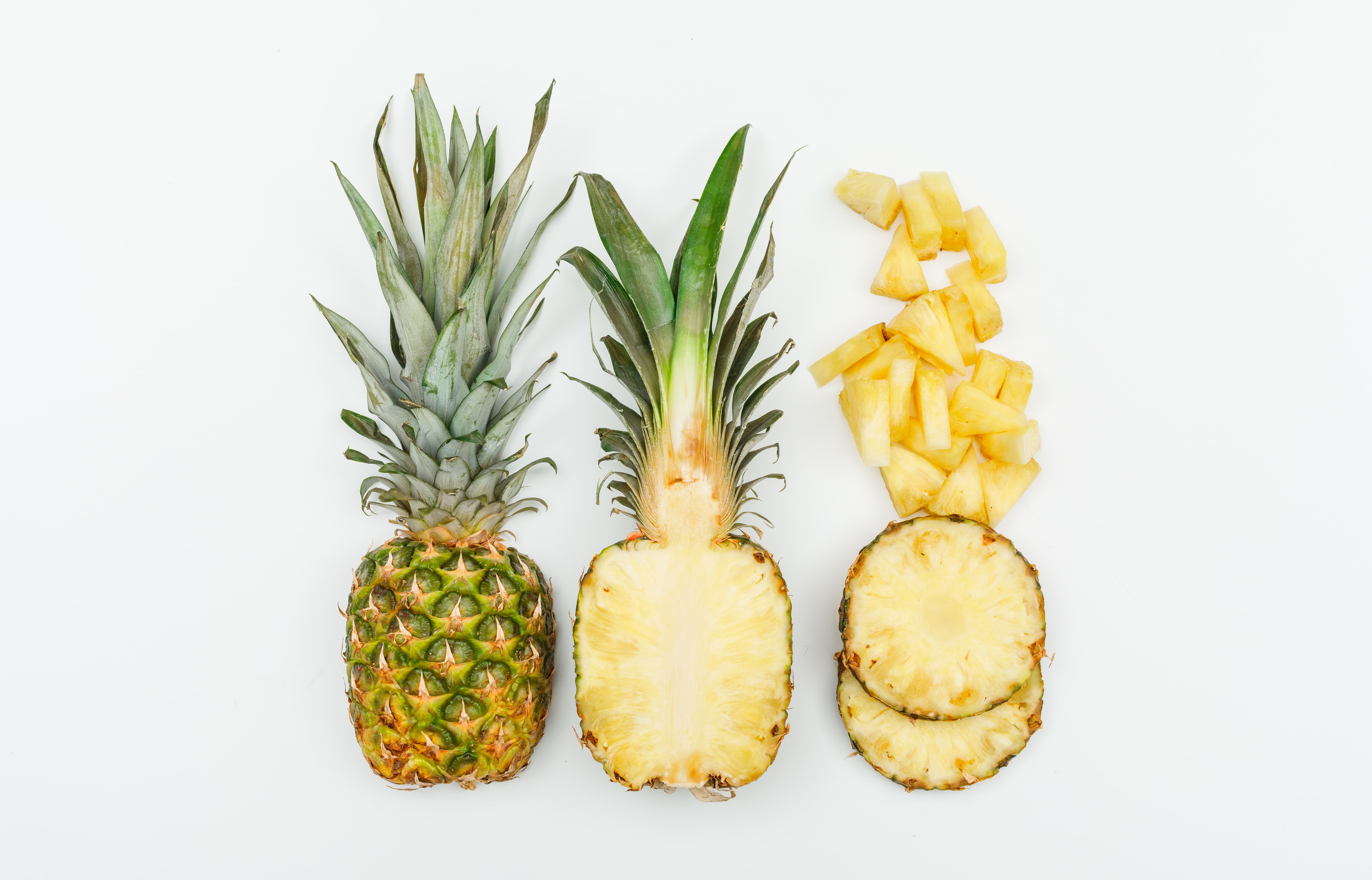 pineapple-whole-half-slices-top-view-white-min.jpg